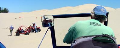 Touring sand dunes, with Diana and driver shown in mirror